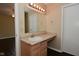 Bathroom featuring a vanity, sink, light fixture, and large mirror at 1966 Freedom Ct, Greenfield, IN 46140