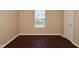 Neutral bedroom with a wood floor and a window that offers great natural light at 1966 Freedom Ct, Greenfield, IN 46140