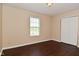 Bedroom with neutral walls, wood floor and a window that offers natural light at 1966 Freedom Ct, Greenfield, IN 46140