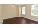 Neutral bedroom with a wood floor and two windows that offer great natural light at 1966 Freedom Ct, Greenfield, IN 46140