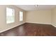 Bright, large bedroom with new flooring and abundant natural light, enhancing the welcoming space at 1966 Freedom Ct, Greenfield, IN 46140