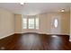 Inviting living room featuring hardwood floors, neutral paint, and a large bay window for ample natural light at 1966 Freedom Ct, Greenfield, IN 46140