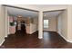 Open-concept space featuring hardwood floors and seamless flow to kitchen, ideal for modern living and entertaining at 1966 Freedom Ct, Greenfield, IN 46140