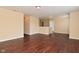 Open living room with dark wood-look flooring, ideal for flexible layout and comfortable living at 1966 Freedom Ct, Greenfield, IN 46140
