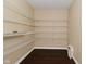 Spacious walk-in pantry offering ample storage with wire shelving, optimizing organization and accessibility at 1966 Freedom Ct, Greenfield, IN 46140