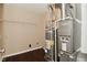 Utility room with water heater and a Lennox heating and air conditioning unit at 1966 Freedom Ct, Greenfield, IN 46140