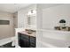 Stylish bathroom featuring a walk-in shower, modern vanity, and ample storage space at 213 S State Ave, Indianapolis, IN 46201