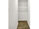 This is a walk in closet with shelving and wood floor at 213 S State Ave, Indianapolis, IN 46201