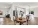 Bright, open kitchen with stainless steel appliances, center island and adjacent dining area at 213 S State Ave, Indianapolis, IN 46201
