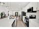 Bright, modern kitchen with stainless steel appliances, island and open layout at 213 S State Ave, Indianapolis, IN 46201