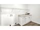 Laundry room with sink and lots of storage at 213 S State Ave, Indianapolis, IN 46201