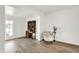 Bright living room with hardwood floors and vintage desk at 213 S State Ave, Indianapolis, IN 46201