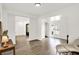 Open-concept living room with hardwood floors, neutral tones, and ample natural light at 213 S State Ave, Indianapolis, IN 46201