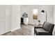 Cozy living room with modern armchair, wine cooler, and natural light at 213 S State Ave, Indianapolis, IN 46201