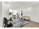 Bright living room featuring an open layout connecting to the kitchen and dining area, with modern furnishings at 213 S State Ave, Indianapolis, IN 46201