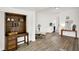 Inviting living room with vintage desk, a wine cooler and neutral palette at 213 S State Ave, Indianapolis, IN 46201