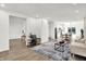 Bright living room featuring an open layout connecting to the kitchen and dining area, with modern furnishings at 213 S State Ave, Indianapolis, IN 46201