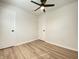 The bright bedroom features updated floors, a ceiling fan, and closet and bedroom doors at 2141 Napoleon St, Indianapolis, IN 46203