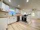 Bright kitchen with butcher block countertops, stainless steel appliances and modern white cabinetry at 2141 Napoleon St, Indianapolis, IN 46203