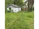 View of a small shed in an overgrown backyard at 2621 N Tacoma Ave, Indianapolis, IN 46218