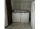 Laundry room featuring a side-by-side washer and dryer and wire shelving at 2621 N Tacoma Ave, Indianapolis, IN 46218