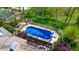 Aerial view of pool and deck area, with house visible with mature landscaping at 265 Monticello Dr, Greenwood, IN 46142