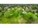 Aerial view showcasing a sprawling property with lush greenery, mature trees, and well-maintained lawns at 265 Monticello Dr, Greenwood, IN 46142