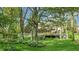 Expansive deck overlooking a lush backyard with mature trees and vibrant greenery, great for outdoor entertaining at 265 Monticello Dr, Greenwood, IN 46142