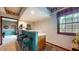 Charming bar area features barstool seating and a view of the outdoor scenery at 265 Monticello Dr, Greenwood, IN 46142