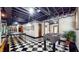 Finished basement with checkerboard floors, foosball, ping pong, and decor at 265 Monticello Dr, Greenwood, IN 46142