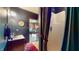 Compact bathroom with sink, mirror, patterned wallpaper, and shower stall at 265 Monticello Dr, Greenwood, IN 46142