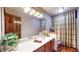 Bathroom features a vanity with a large mirror, tasteful decorations, and plenty of light at 265 Monticello Dr, Greenwood, IN 46142