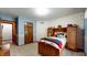 Comfortable bedroom featuring classic details, playful wallpaper, and ample natural light at 265 Monticello Dr, Greenwood, IN 46142