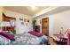 Comfortable bedroom with floral bedding, rocking chair, and unique wall decor at 265 Monticello Dr, Greenwood, IN 46142