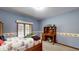 Inviting bedroom offers a cozy study area, large windows, and a comfortable atmosphere at 265 Monticello Dr, Greenwood, IN 46142
