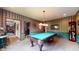 This game room features an elegant pool table with overhead lighting and decorative walls at 265 Monticello Dr, Greenwood, IN 46142