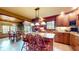 Eat-in kitchen featuring granite countertops, custom cabinetry, stainless appliances, and natural light at 265 Monticello Dr, Greenwood, IN 46142