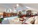 Bright living room offering ample bookcase storage, comfortable seating, and warm decor at 265 Monticello Dr, Greenwood, IN 46142