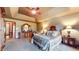 Relaxing primary bedroom suite featuring tray ceiling, large bed, and ensuite bathroom at 265 Monticello Dr, Greenwood, IN 46142