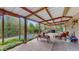 Covered patio featuring exposed rafters, view of pool and outdoor lounge furniture at 265 Monticello Dr, Greenwood, IN 46142
