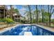 Inviting in-ground pool with diving board and stainless steel ladder, surrounded by a well-maintained patio at 265 Monticello Dr, Greenwood, IN 46142