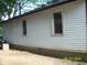 Exterior shot showcasing the side of the house and the large windows at 3049 S Rybolt Ave, Indianapolis, IN 46241