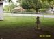 Grassy backyard featuring well-maintained landscaping and an ornamental bird bath at 3057 S Rybolt Ave, Indianapolis, IN 46241