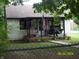 Charming home featuring a cozy front porch with swing, perfect for relaxing and enjoying the outdoors at 3057 S Rybolt Ave, Indianapolis, IN 46241
