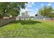 Spacious backyard with lush green grass and partial fencing at 311 Duffey St, Plainfield, IN 46168