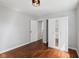 Bedroom with refinished hardwood floors, closet, and fresh paint at 311 Duffey St, Plainfield, IN 46168