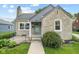 Charming stone-clad home featuring a quaint front entrance and well-maintained landscaping at 311 Duffey St, Plainfield, IN 46168