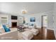 Bright living room with fireplace, hardwood floors, and ample natural light at 311 Duffey St, Plainfield, IN 46168