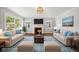 Bright living room with fireplace, hardwood floors, and ample natural light at 311 Duffey St, Plainfield, IN 46168