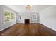 Bright living room with fireplace, hardwood floors, and ample natural light at 311 Duffey St, Plainfield, IN 46168
